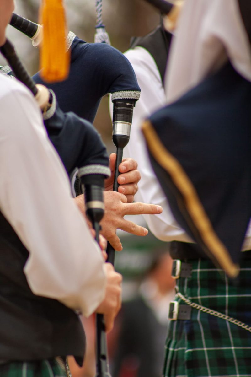 Pipers' fingers on their chanters, close up