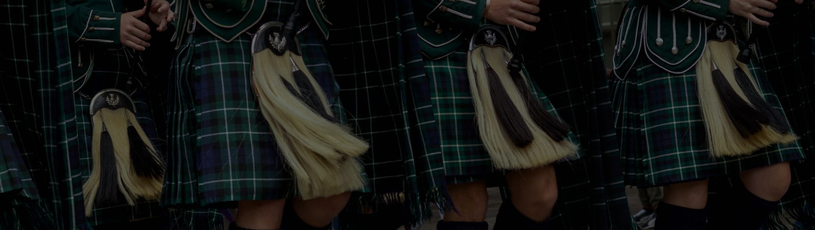 The band's pipers marching in kilts